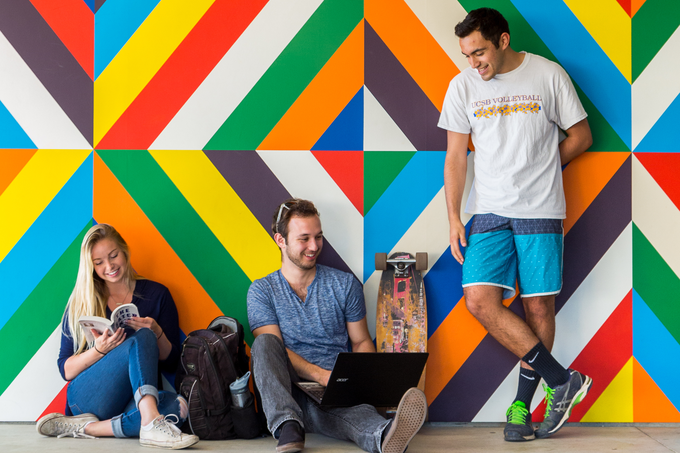 UCSB students in front of mural