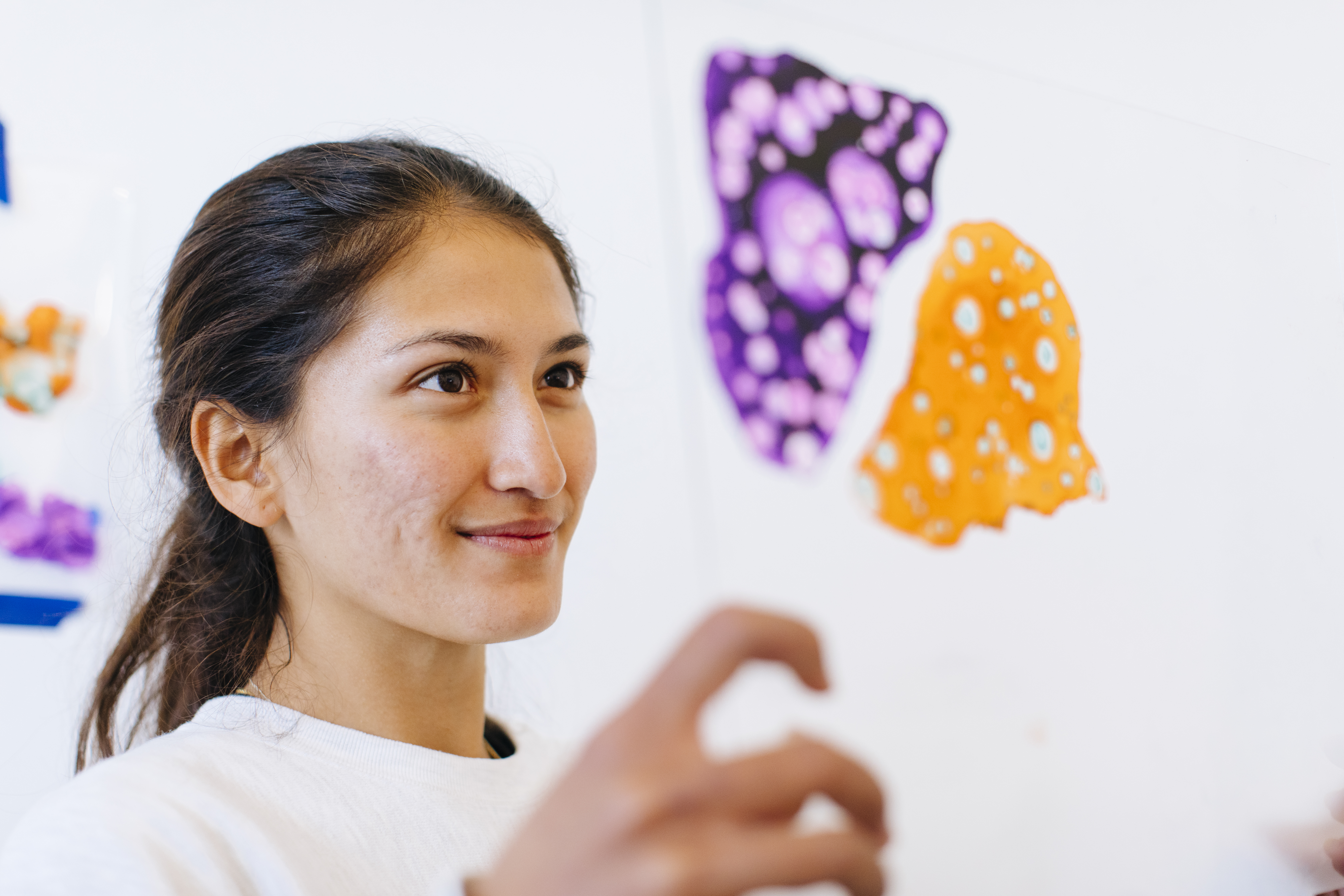 student looking at art